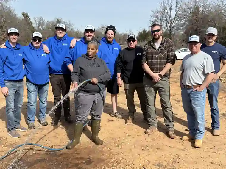 02.2026-Adams-Fam-with-Volunteers_Driller-2